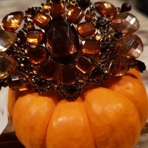 A beautiful gold and brown and orange  stone brace